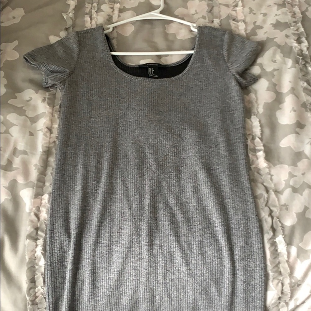 Tight fitting silver dress.